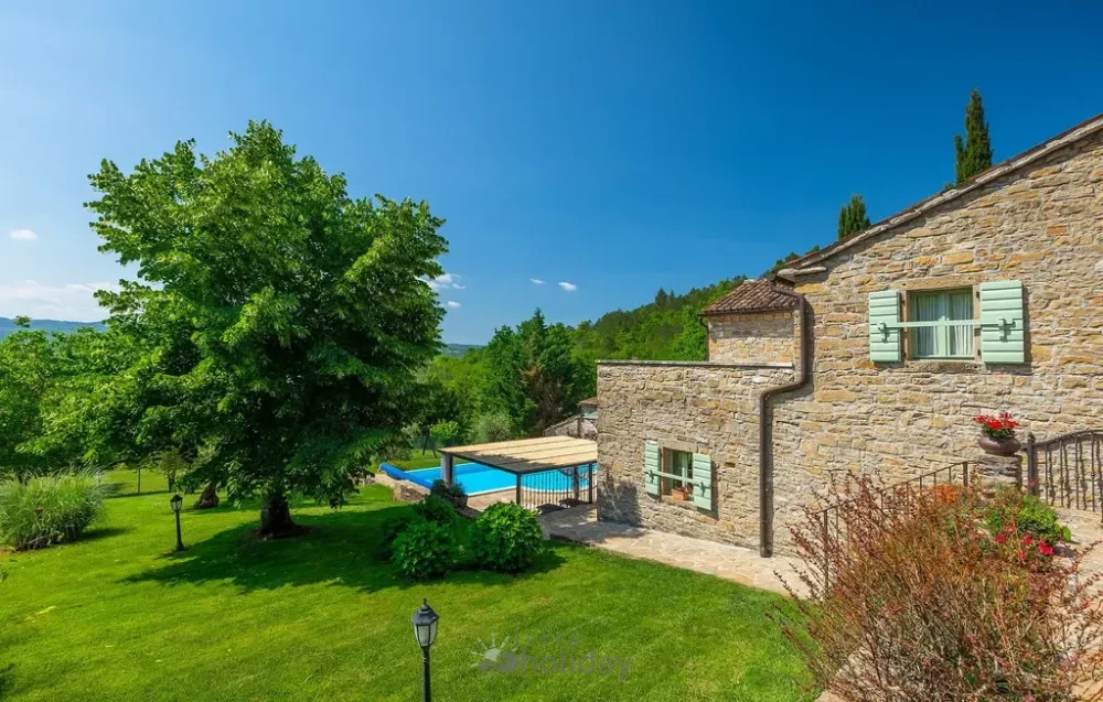 Stone house and pool with garden view