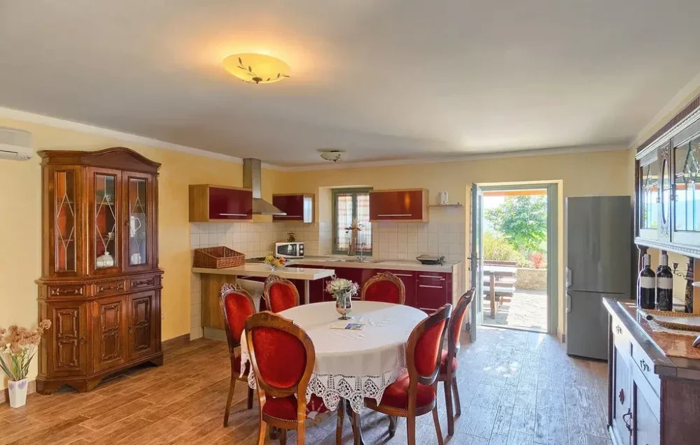 Rustic kitchen with dining table and outdoor view