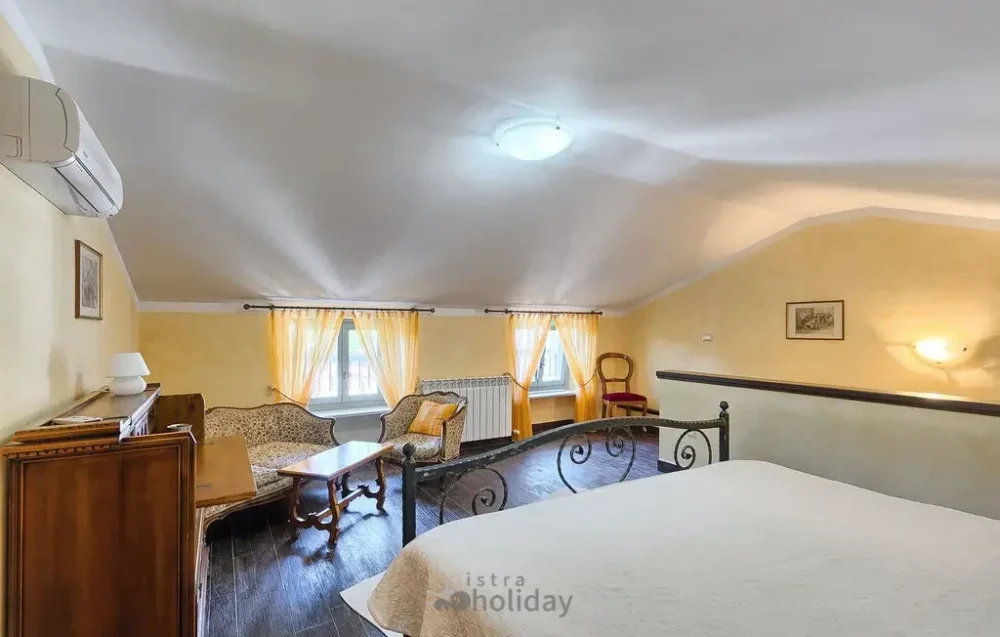 Cozy attic bedroom with vintage furniture