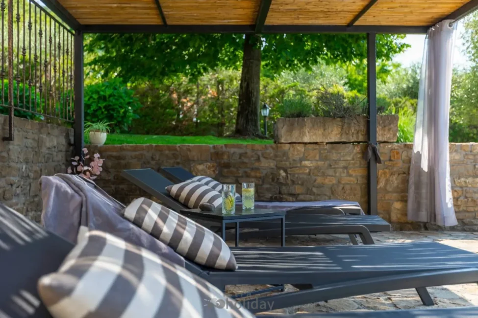 Outdoor patio with lounge chairs and drinks