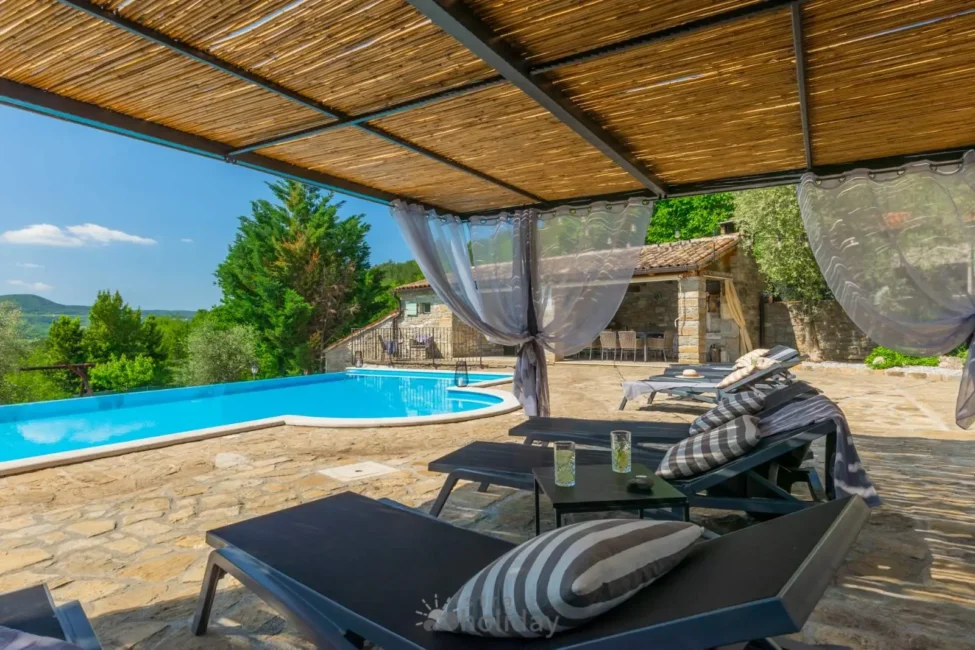 Poolside lounge area with scenic view