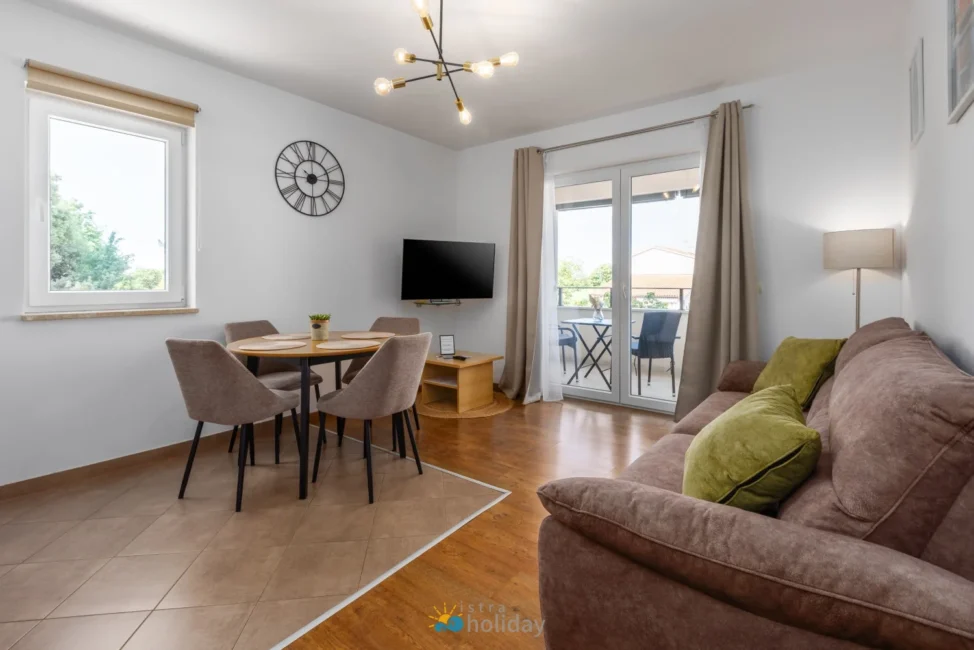 Modern living room with dining area and balcony