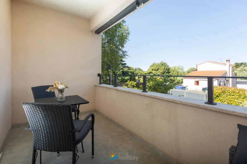 Cozy balcony with table and neighborhood view