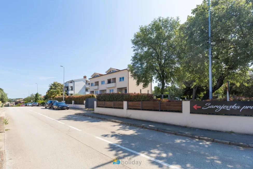 Quiet residential street with modern apartment buildings
