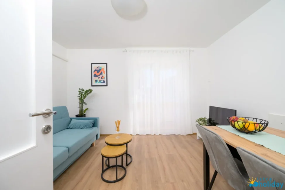 Modern living room with blue sofa and artwork