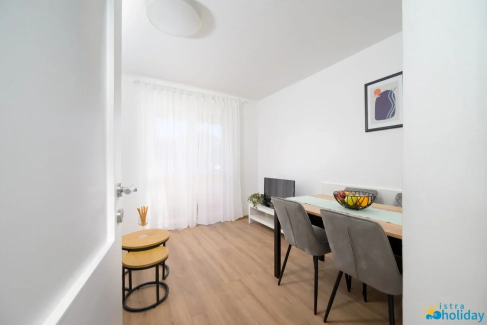 Modern dining room with natural light.