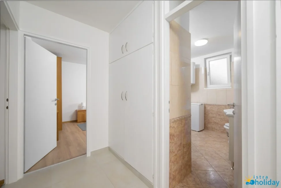 Hallway leading to bathroom and bedroom