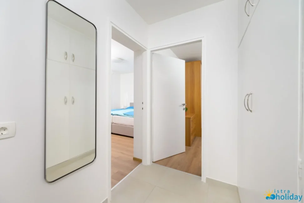 Modern hallway leading to a bedroom