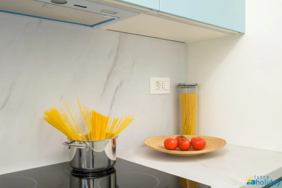 Kitchen counter with pasta and tomatoes