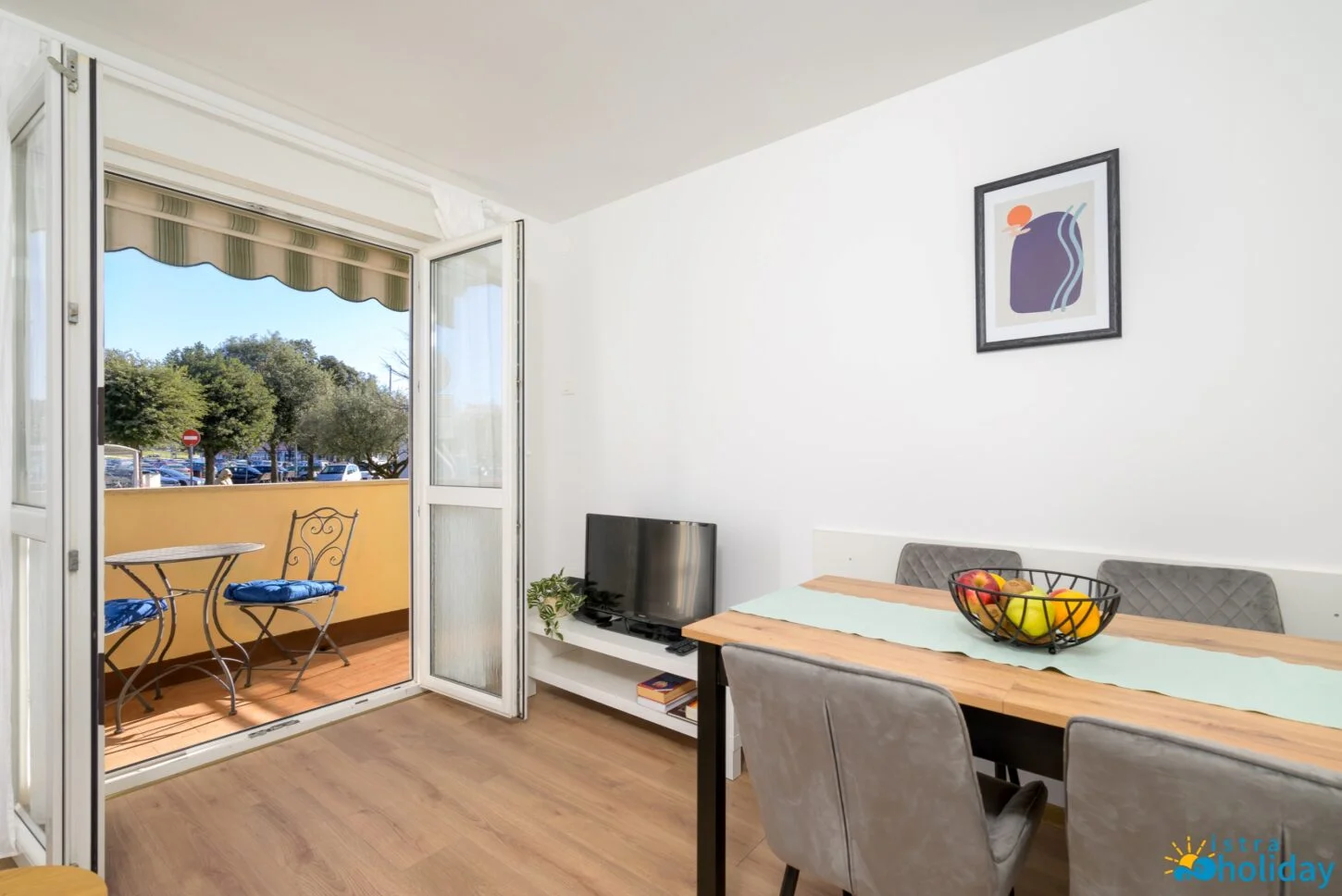 Bright dining area with balcony view