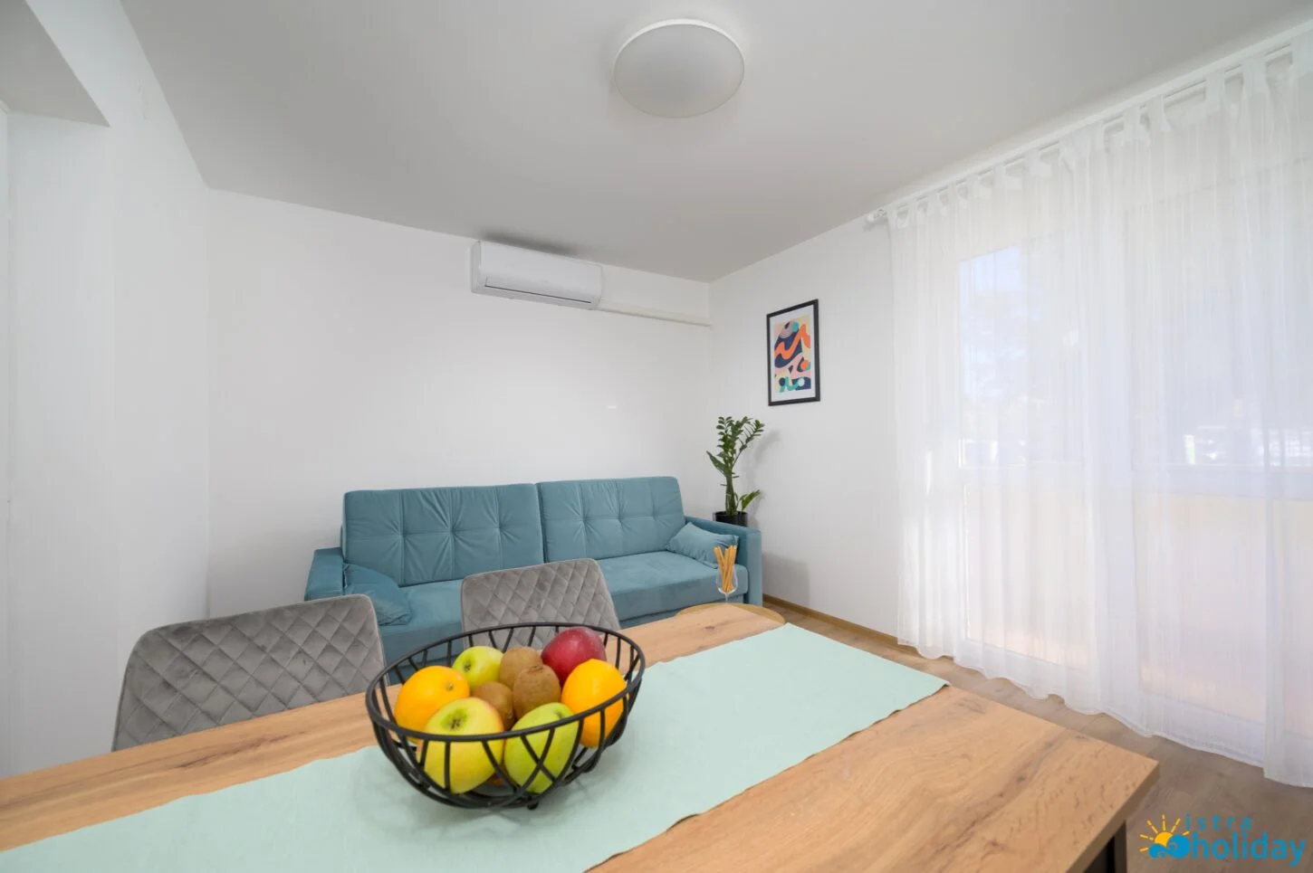 Modern living room with fruit bowl centerpiece.