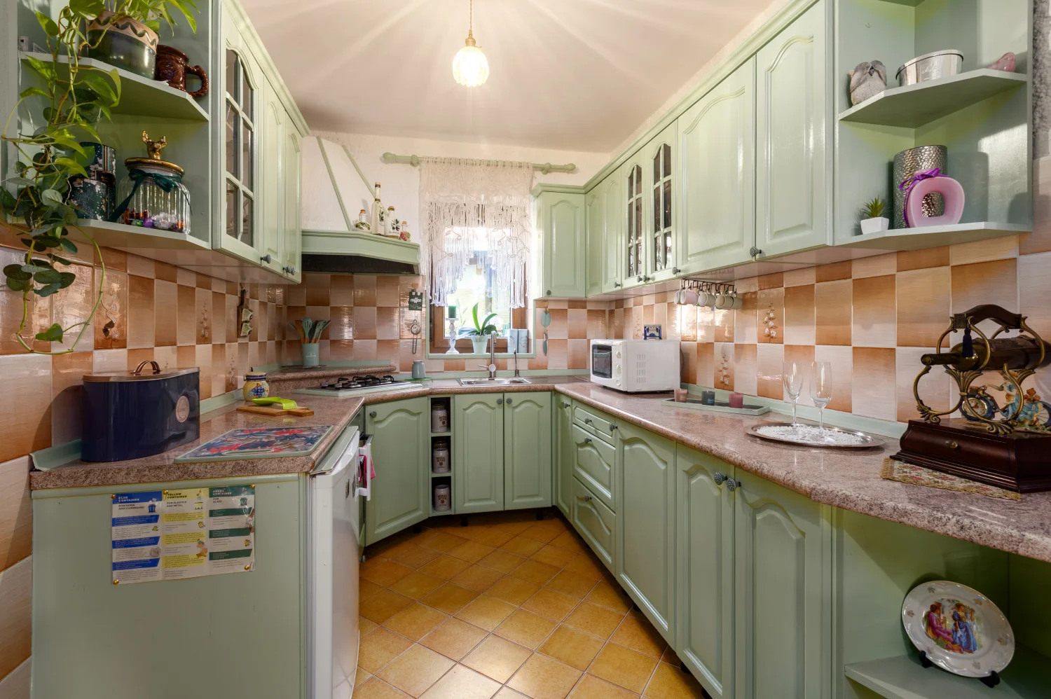 Vintage mint green kitchen with checkered backsplash