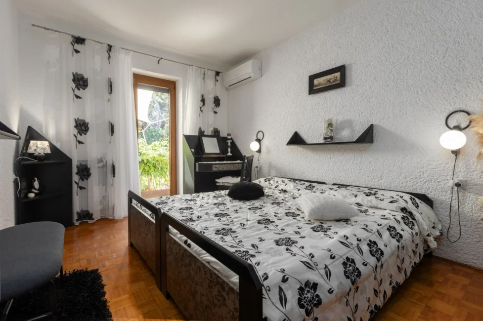 Cozy bedroom with black and white floral bedding