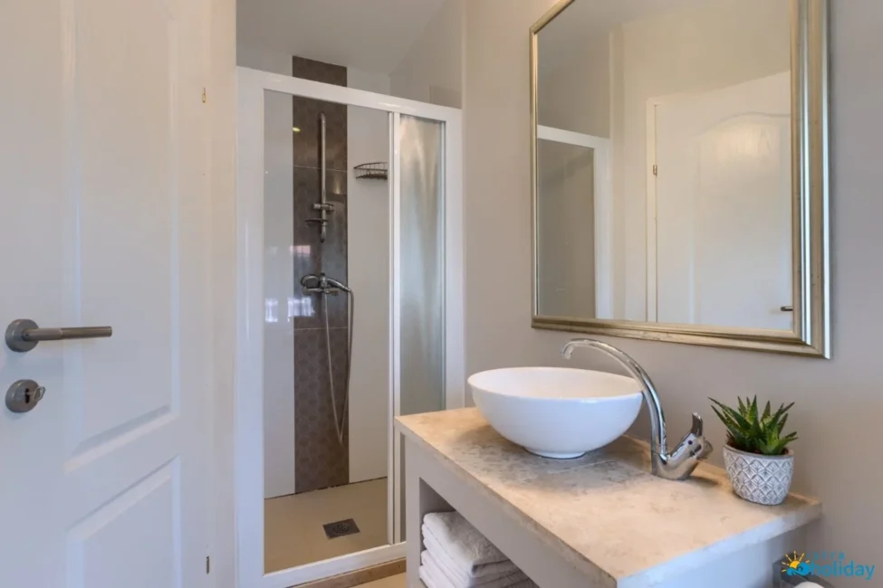 Modern bathroom with shower and vanity sink