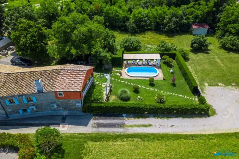 Aerial view of house with pool and garden