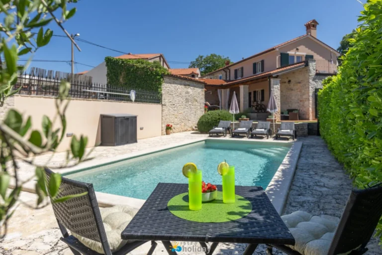 Luxury villa with private pool and lounge chairs