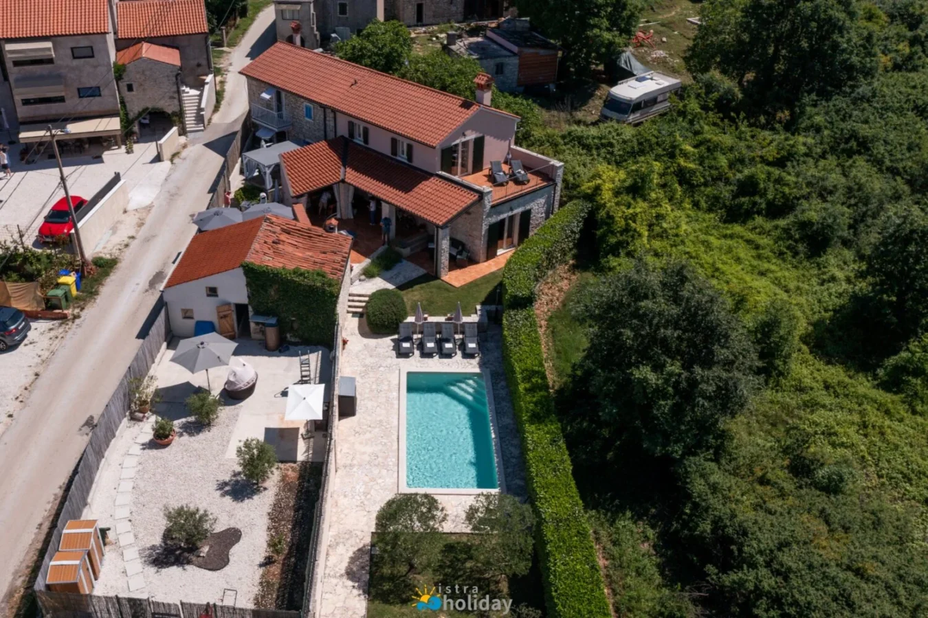 Aerial view of villa with pool and garden
