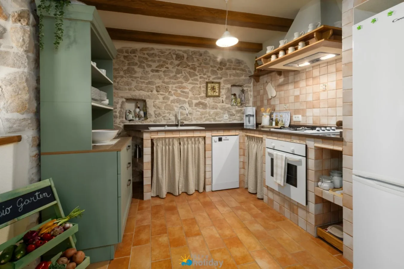 Rustic farmhouse kitchen with stone walls and tiles
