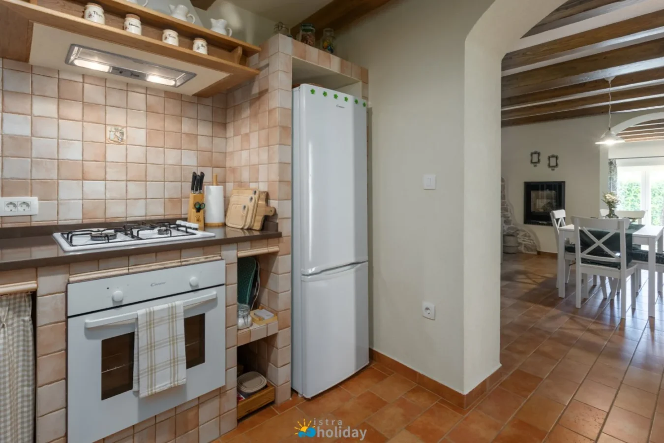 Rustic kitchen with tiled backsplash and dining area