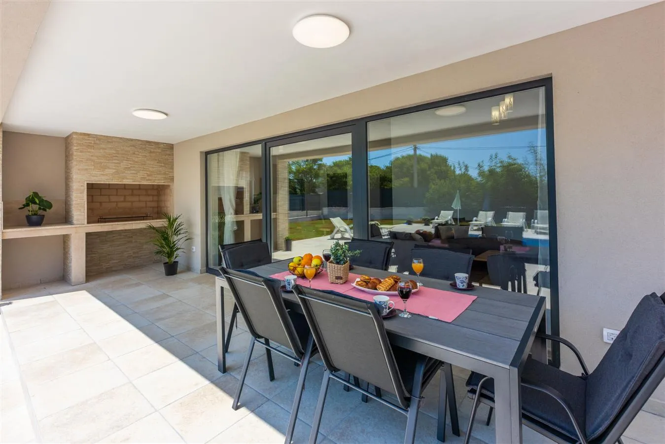 Modern covered patio with outdoor dining table