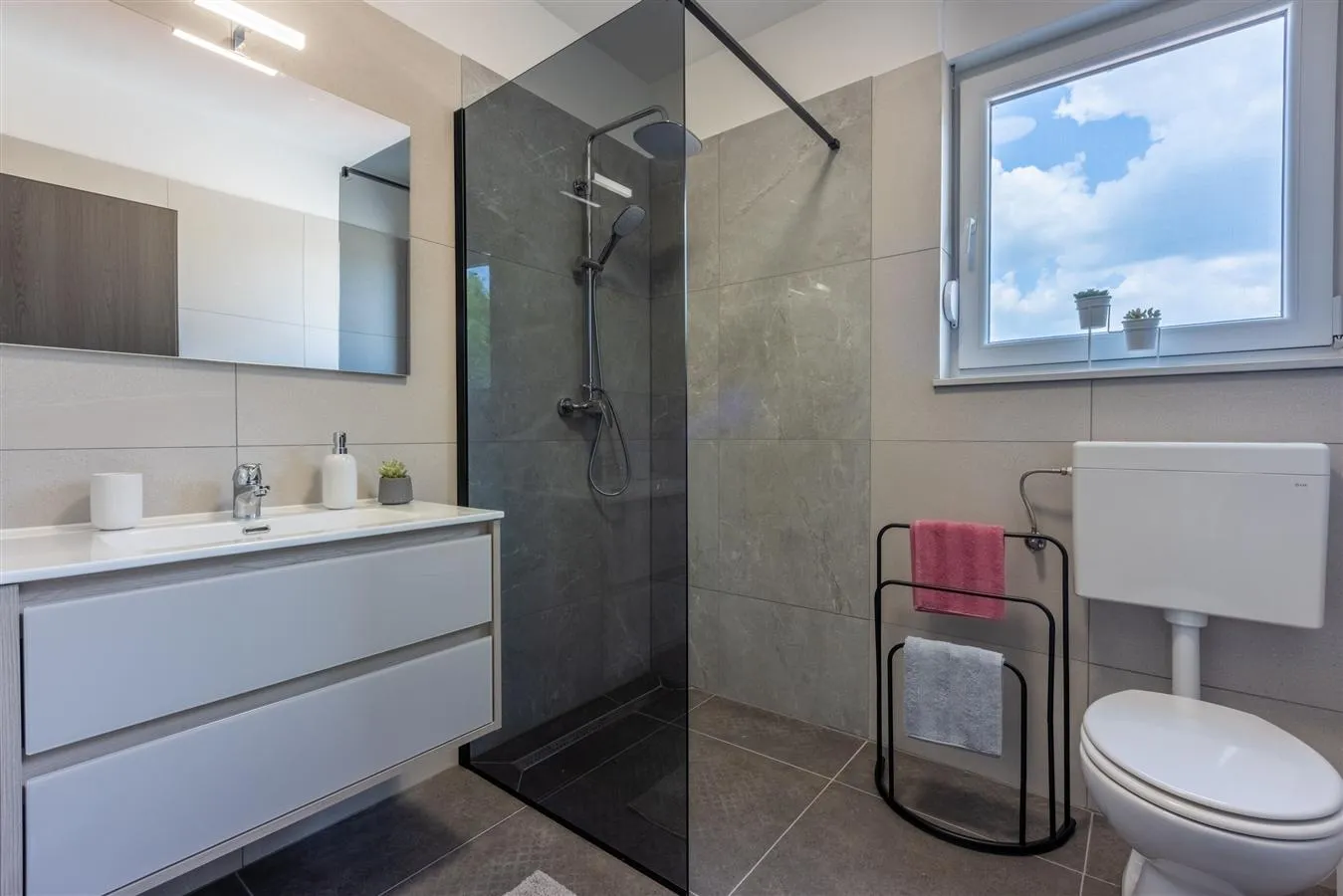 Modern bathroom with glass shower and vanity