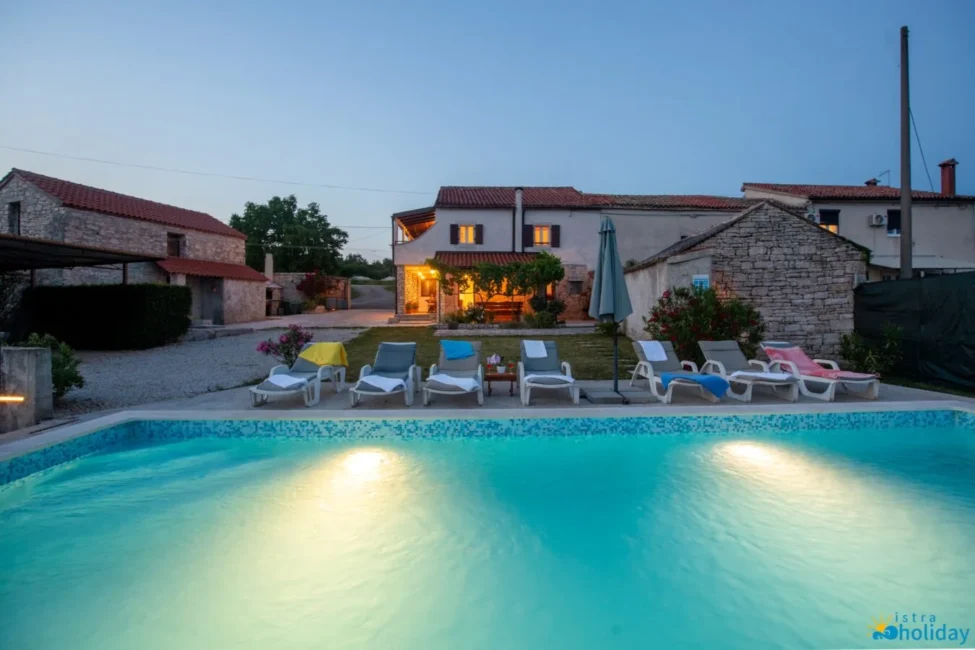 Charming villa with pool at dusk