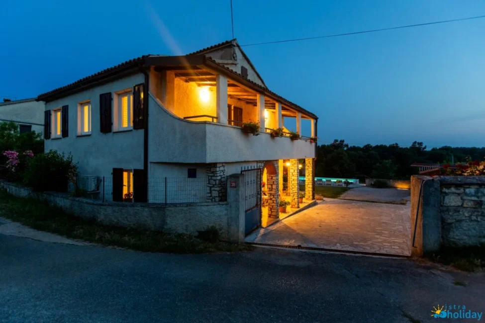 Charming illuminated villa at twilight.