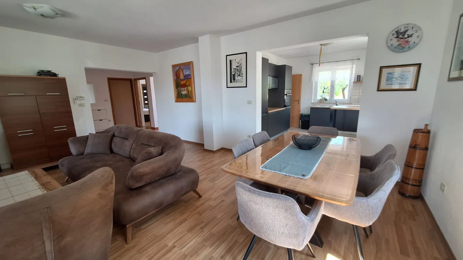 Modern open-plan living and dining area with kitchen