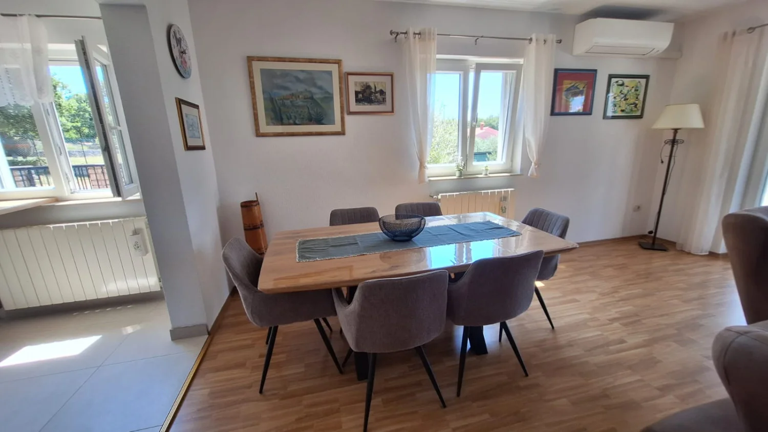 Bright dining room with wooden table and chairs