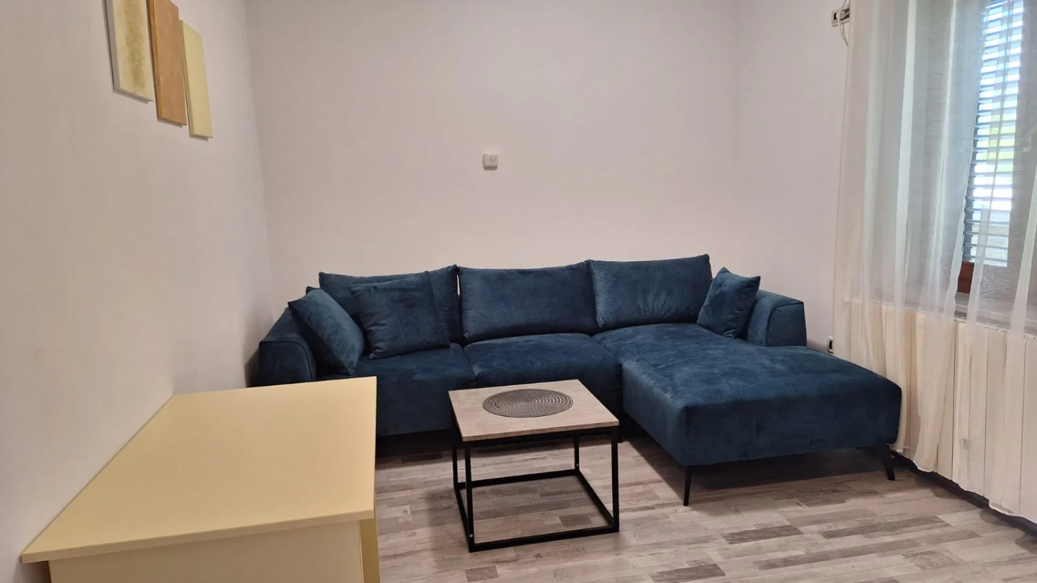 Modern living room with blue sectional sofa