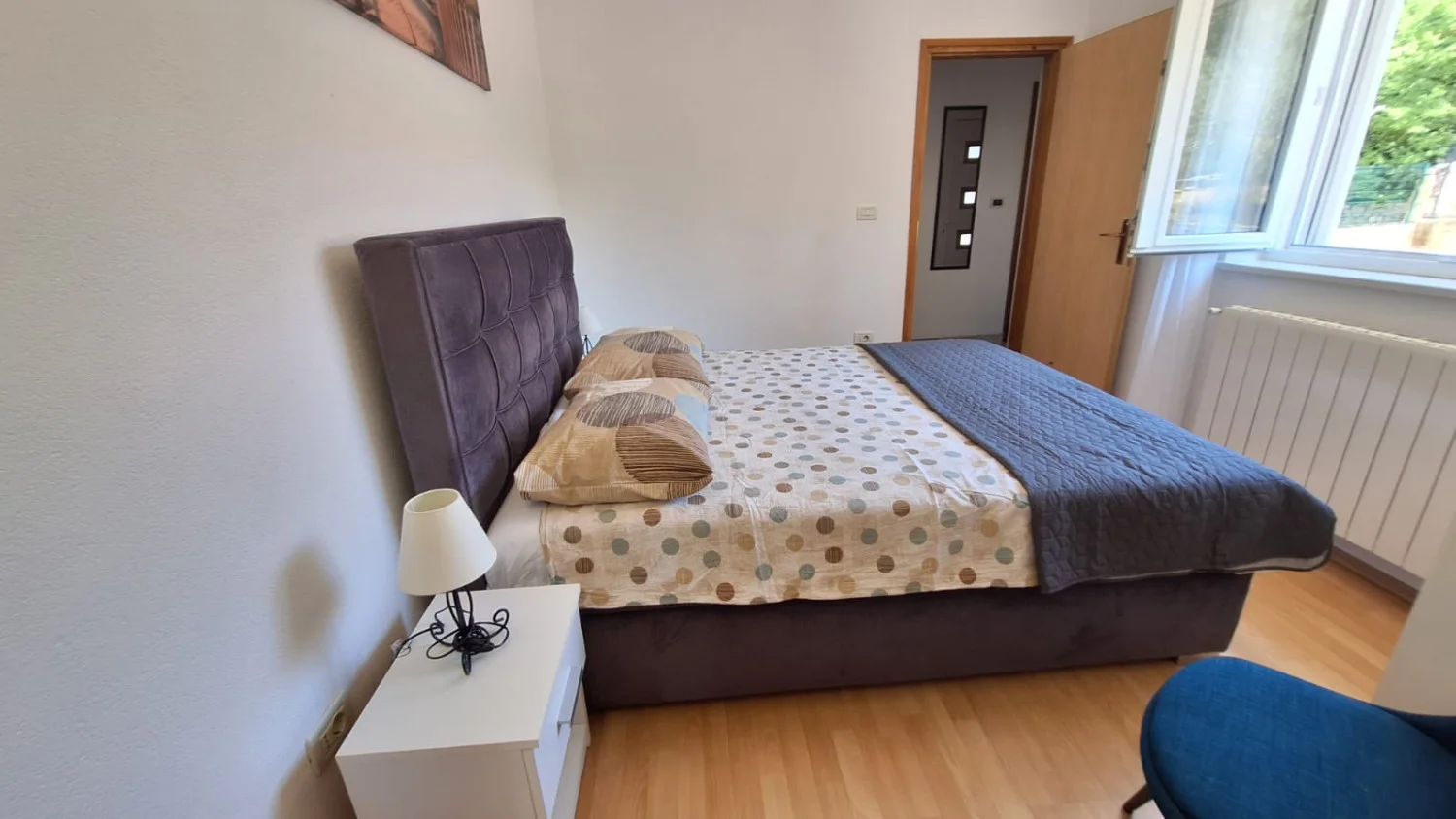 Modern bedroom with double bed and window