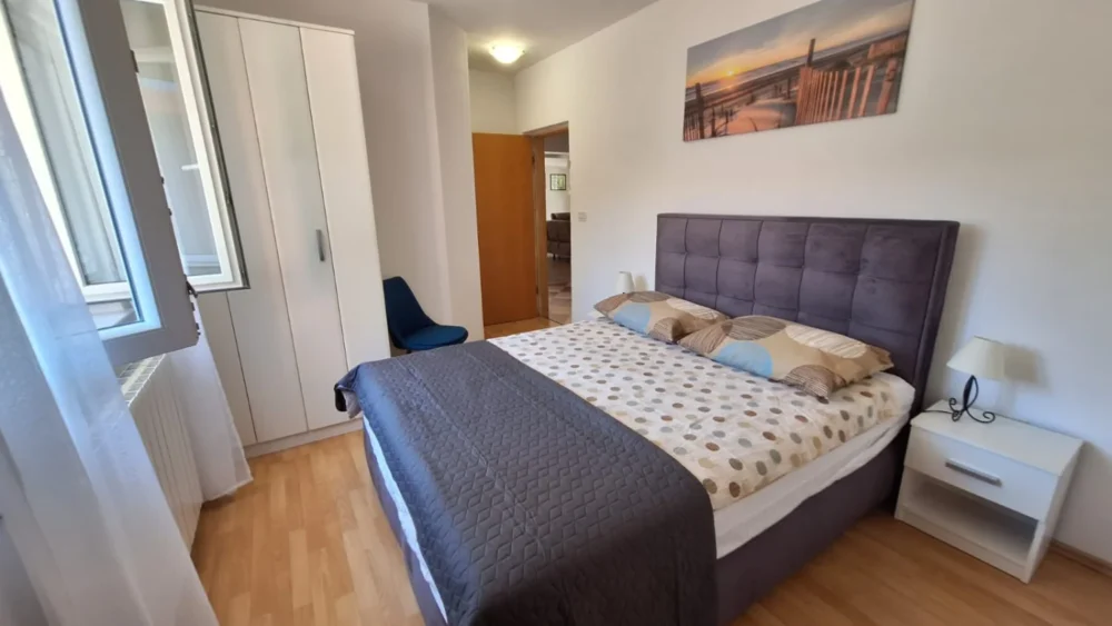 Modern bedroom with double bed and wardrobe
