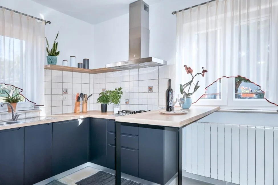 Modern kitchen with dark cabinets and wooden countertops