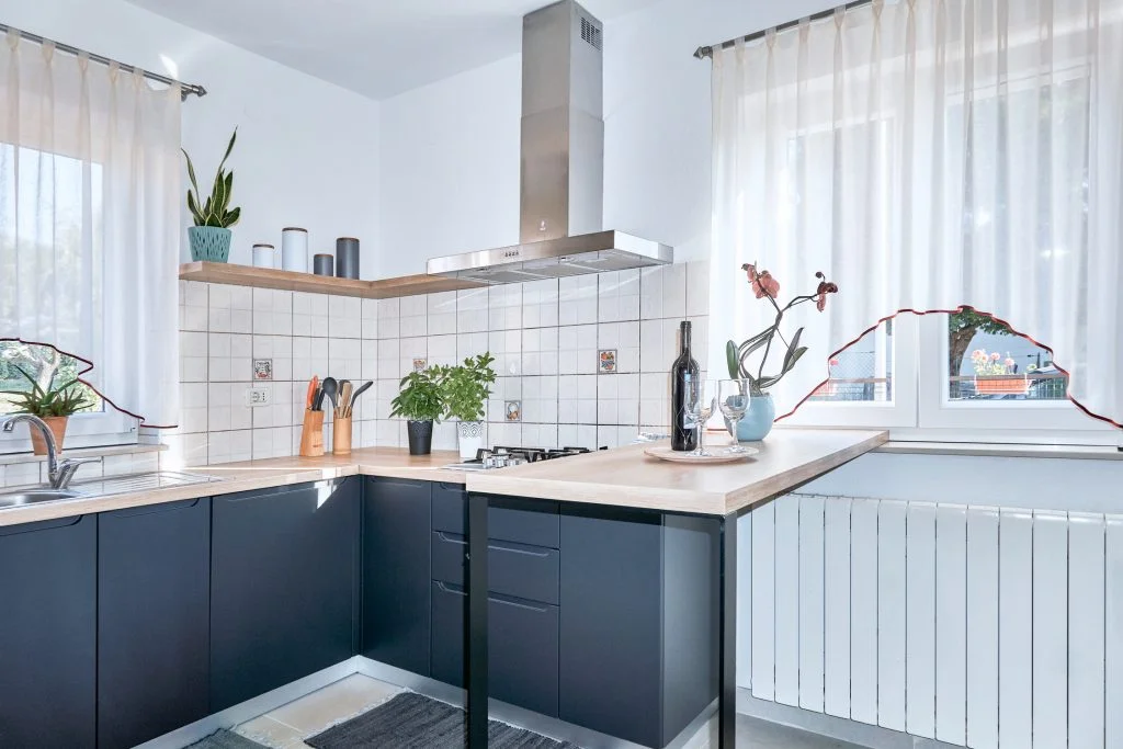 Modern kitchen with dark cabinets and wooden countertops